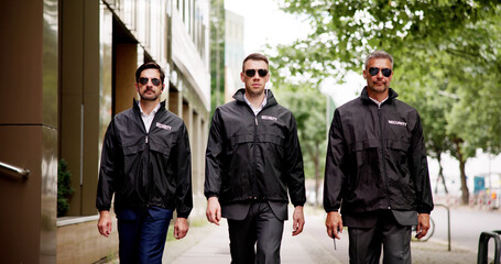 group of security officers are patrolling the streets, safeguarding buildings