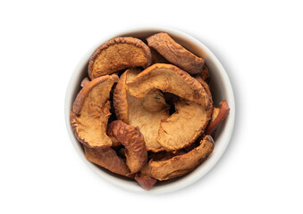 Ceramic bowl with sweet dried organic apple pieces isolated on white background.Top view.