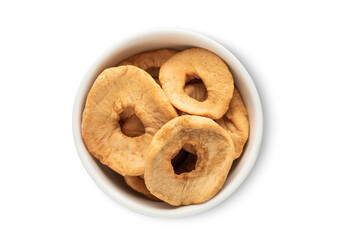 Ceramic bowl with sweet dried organic apple circles isolated on white background.Top view.