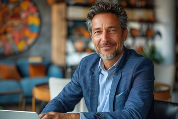 Fototapeta premium Professional Businessman in Blue Suit Working at Office Desk