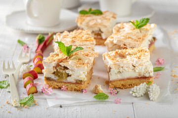 Homemade and tasty rhubarb yeast cake served with tea.