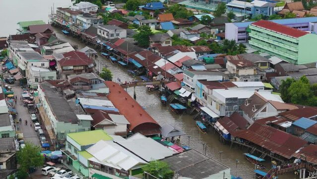 Aerial view local boat on floating river market sell traditional food and drink in Thailand