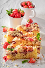 Tasty and sweet strawberry cake with berries and crumble.