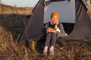 Middle aged woman in tent at campsite