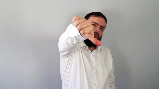 Hater Man Showing Dislike Sign with Gesture Showing Hate, Internet bullying, Cyberbullying, trolling, Disagreement, Disapproving, Negative reaction, Rejection, Distaste, Abuse