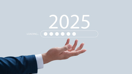 Businessman shows download bar counting down to 2025, New Year's Eve welcoming the new year from 2024 to 2025, developing towards success and sustainable growth concept.