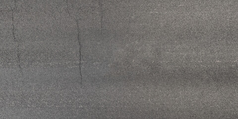 view from above on texture of asphalt road with cracks