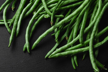 Green beans on a dark background