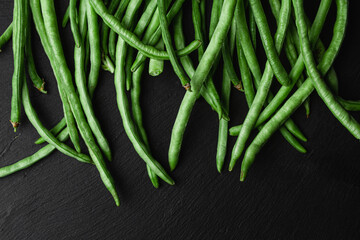 Green beans on a dark background