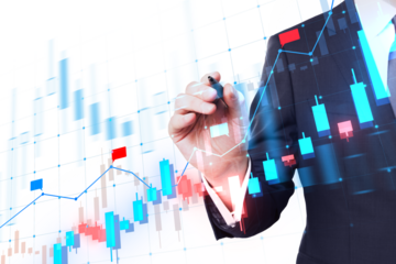 A person with a business suit is drawing on a transparent financial chart overlay, with a high-tech and corporate concept