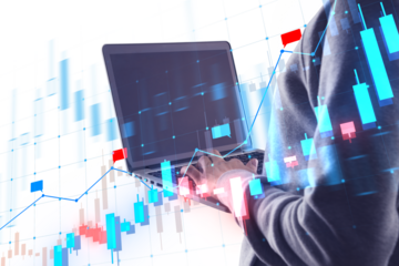 A person using a laptop with superimposed financial graphs, on a white background, illustrating data analysis