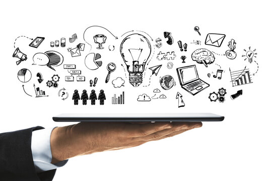 A hand holding a tablet with a variety of doodle drawings representing ideas and concepts floating above it, on a white background