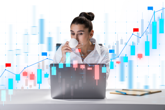A woman sitting at a desk sipping coffee while looking at a laptop with financial graphs overlaying the image, on a light background, symbolizing analysis