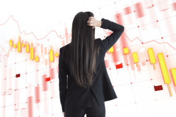 Person looks at financial charts on a transparent digital interface, concept of business analysis