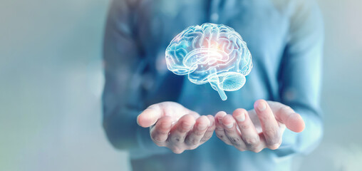 A person holds their hands out with a holographic brain floating above them representing the concept of AI learning and self improvement in mental health