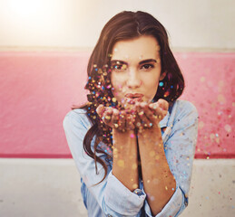 Portrait, woman and blowing confetti in celebration as gen z for birthday, festival or new years...