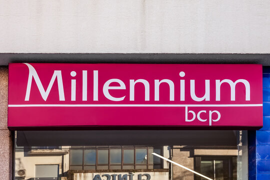 Vila Nova de Famalicao, Portugal - December 23, 2023: Millennium Bcp aka Banco Comercial Portugues logo, symbol or emblem in the facade of bank agency. and One of largest private banks in Portugal