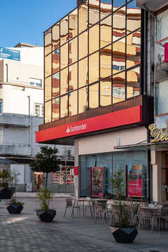 Vila Nova de Famalicao, Portugal - December 23, 2023: Santander bank agency with logo, symbol or emblem of Santander bank. Santander is the largest private bank in Portugal