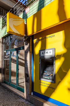 Vila Nova de Famalicao, Portugal - December 23, 2023: Banco Montepio bank with an exterior Multibanco aka ATM machine terminal managed by SIBS, with brand logo, sign or symbol of Banco Montepio bank