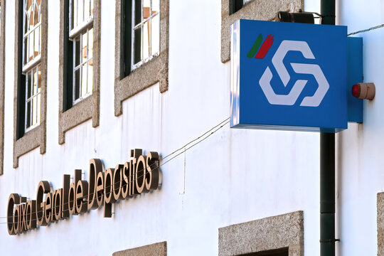 Vila Nova de Famalicao, Portugal - December 23, 2023: CGD aka Caixa Geral de Depositos logo, symbol or emblem in facade of bank agency. State owned bank and the largest in Portugal