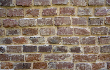 Stone background of red bricks.
