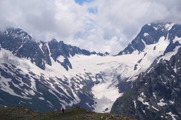 Beautiful view of the Caucasus mountains with people. Dombai. The natural landscape.