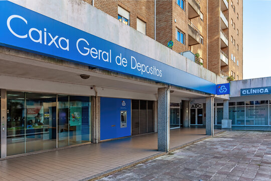 Vila Nova de Famalicao, Portugal - December 23, 2023: Modern CGD aka Caixa Geral de Depositos bank agency, with a Multibanco aka ATM machine. State owned bank and the largest in Portugal
