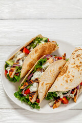 grilled chicken street tacos on a white plate
