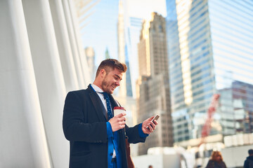 City, reading and businessman with mobile phone for chat, communication and networking. Urban,...