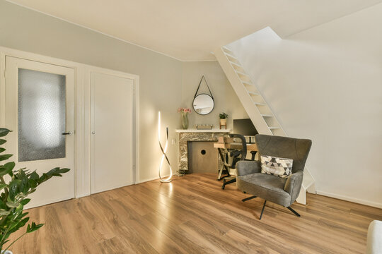 Contemporary home office with warm wooden floors - Powered by Adobe