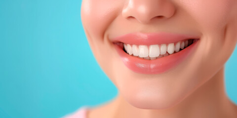 Fototapeta premium Close-up of a woman's perfect white smile on a blue background. Suitable for dental clinics, wellness businesses, healthcare, beauty, and spa industries. Concept of dental health, beauty, and well