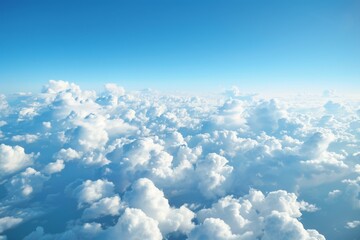 A breathtaking view of a clear blue sky with puffy white clouds from an airplane window. The horizon stretches out, meeting the sky at a gentle curve.