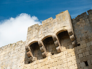 Medieval castle stone wall with balcony