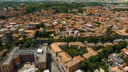 Aerial view of the historic center of Viterbo and its walls that separate it from the modern city. It is one of the capitals of Lazio and is located in central Italy.