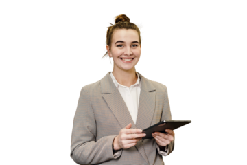 A successful businesswoman is seen using a tablet computer, while wearing glasses and a professional jacket. The background has been cut out.
