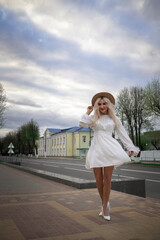 Portrait of a young beautiful blonde girl outdoors.