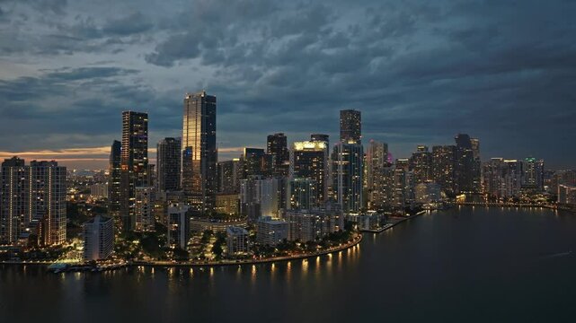 Establishing aerial panoramic shot of Miami Skyline Brickell downtown in 4K. Beautiful aerial shot of Miami modern skyscraper illuminated. Best Miami aerial shot