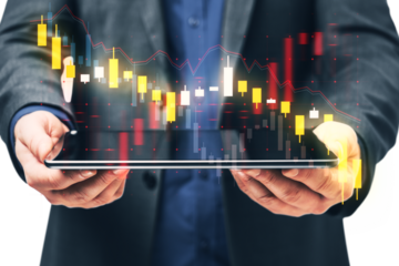 A person in a suit holding a tablet with stock market investment graph on the screen, over a white background, symbolizing financial analysis