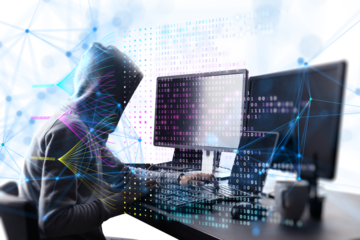 A person in a hoodie typing on a keyboard with digital binary code and network lines overlay, concept of hacking or cybersecurity