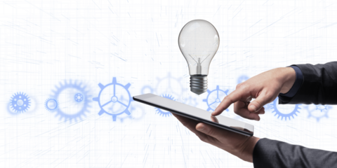 A hand holding a tablet with a light bulb and gears graphic overlay on a white background, representing innovation and technology