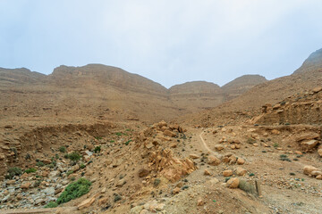 Steep rocky slopes with scattered boulders and sparse vegetation. Unique terrain often used as a filming location for 'Jurassic' movies, Northern Morocco, Morocco.