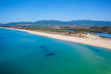 Drone aerial view of San Pietro a Mare wild beach coast in Sardinia, Italy