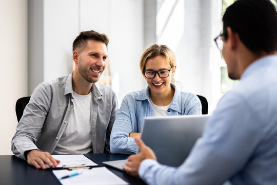 young couple is meeting with a financial planner