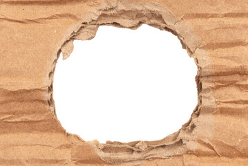 Hole in cardboard. A torn piece of cardboard or paper. Blank space for text