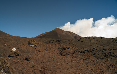 Mount Etna, Sicily - Tallest active volcano of Europe 3329 m in Italy. Panoramic wide view of the active volcano Etna, extinct craters on the slope, traces of volcanic activity.