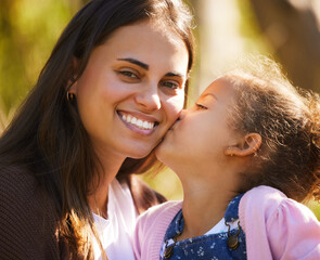 Fototapeta premium Mother, child and kiss in park portrait, love and bonding to connect in childhood at garden. Mom, daughter and support for security in outdoor nature, happiness and affection or care in relationship