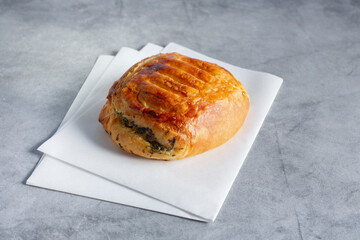 A view of a savory spinach croissant.