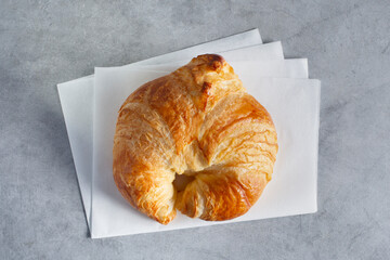 A top down view of a croissant.
