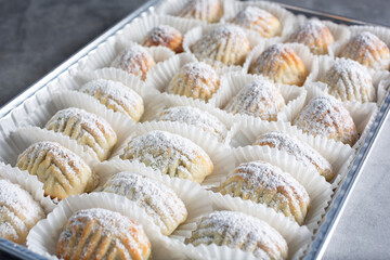 A closeup view of a tray of assorted maamoul cookies.