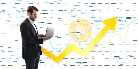 A businessman using a laptop with bitcoin and stock market graphics in the background, concept of cryptocurrency and finance